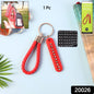 Close-up of anti-lost keychain with unique number plate and braided strap
