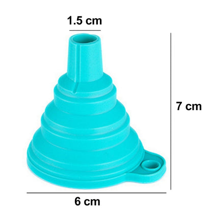 Red silicone funnel pouring juice into a glass bottle on a kitchen counter.