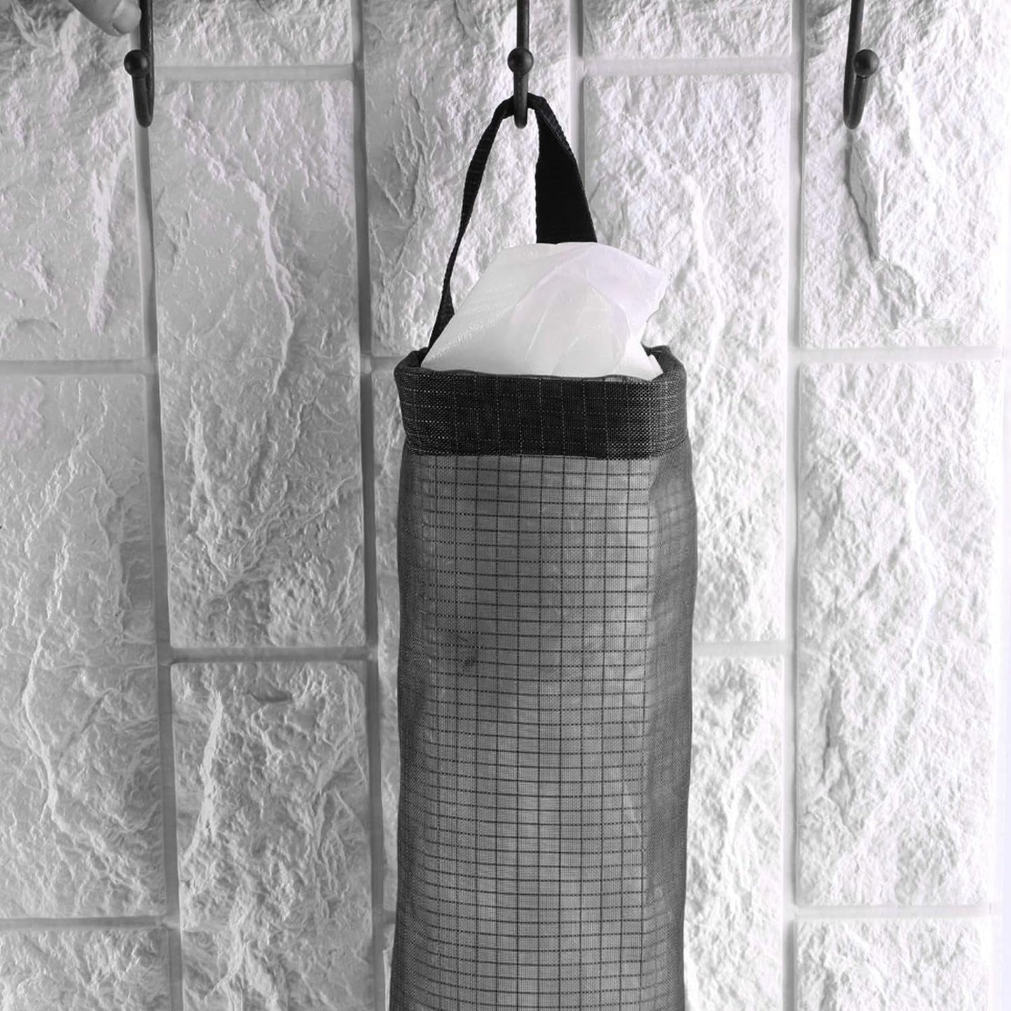 Back view of the waste bag holder, showing the wide handle for easy hanging on a hook.