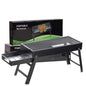 FirePot portable charcoal BBQ grill unfolded and ready for use outdoors.