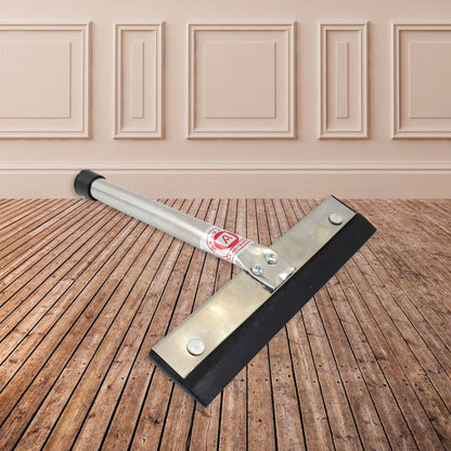 The stainless steel kitchen wiper resting on a tiled surface, demonstrating its compact size.
