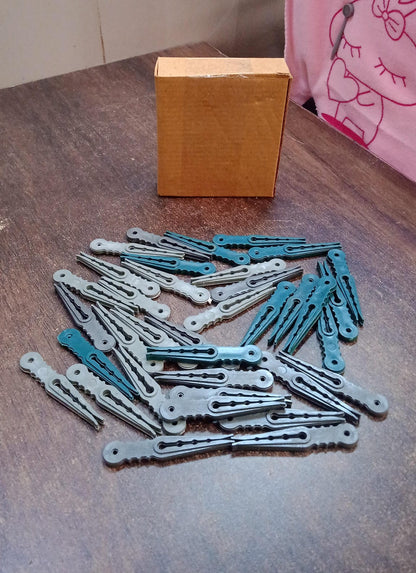 An image illustrating the compact size and easy storage of the 36 Pcs plastic cloth pegs.