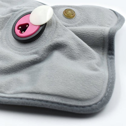 Detailed view of the electric heating pad's soft cloth material for soothing warmth.
