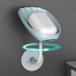 Grey self-draining soap dish with a bar of soap, showcasing its sleek design.