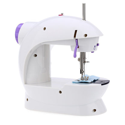 XcelCraft mini sewing machine performing a straight-line stitch on fabric.