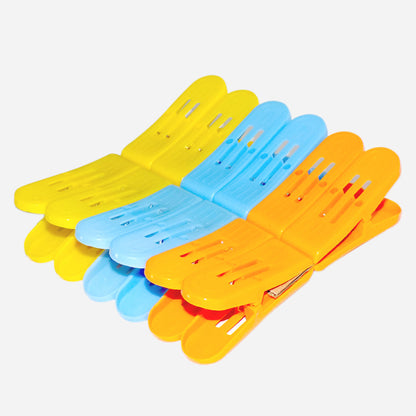 Multicolour plastic double pin cloth drying clips with strong grip for laundry.