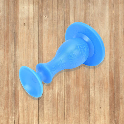 Versatile washer door stopper also functioning as a prop for a room door.