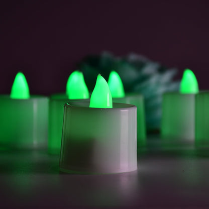 Plastic smokeless green decorative candles creating a warm ambiance.