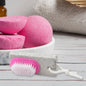 XcelCraft pumice stone foot scrubber with dual-action brush for smooth feet.