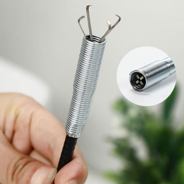 Flexible spring design of the pipe dredging tool, showcasing its maneuverability in drains.