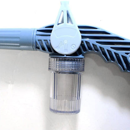 The 8-in-1 water spray gun placed in a vibrant garden environment.