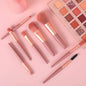 An 8-piece mini makeup brush set with a light pink handle and synthetic bristles, arranged neatly.