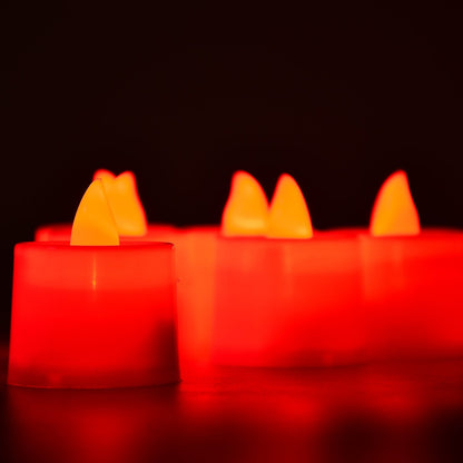 Smokeless and decorative red LED candles enhancing a festive setting.