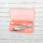 AuriGlam portable nail clipper set in its clear plastic travel case.