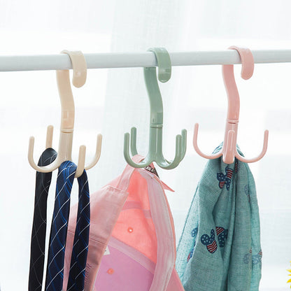 A brown handbag neatly hung on the 360-degree rotatable purse hanger hook, demonstrating its utility.