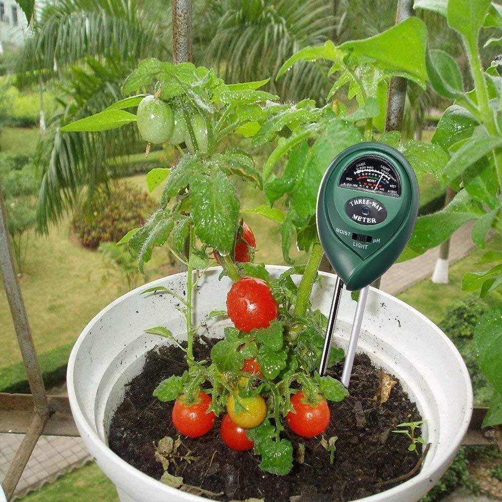 Green 3-in-1 soil tester with dual probes for plant health.