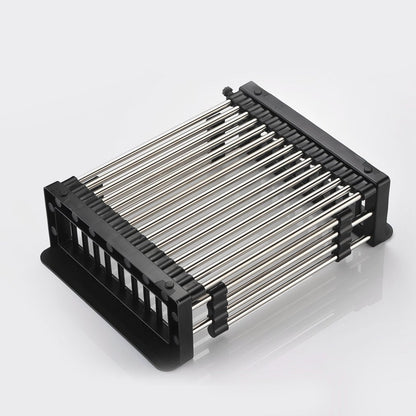 Stainless steel dish drainer holding plates and cups, demonstrating its capacity.