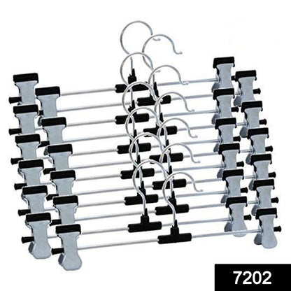 Stainless steel hangers with adjustable clips securely holding a pair of trousers.