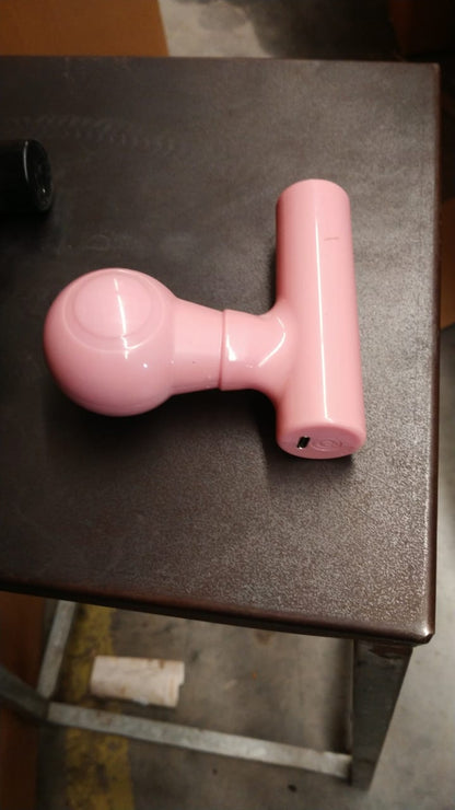 Black mini body massager presented in its retail box packaging.