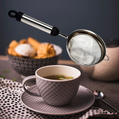 Fine mesh stainless steel strainer ready to filter juice or tea.