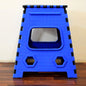 A Tidy Table 18-inch plastic step stool, folded, showing its compact design.
