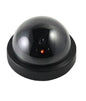 Realistic wireless dummy security camera with a visible lens for effective deterrence.
