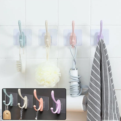 A versatile self adhesive wall hook installed on a kitchen tile, holding a towel.