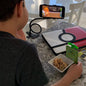 Flexible phone stand with 360-degree rotation for hands-free viewing.