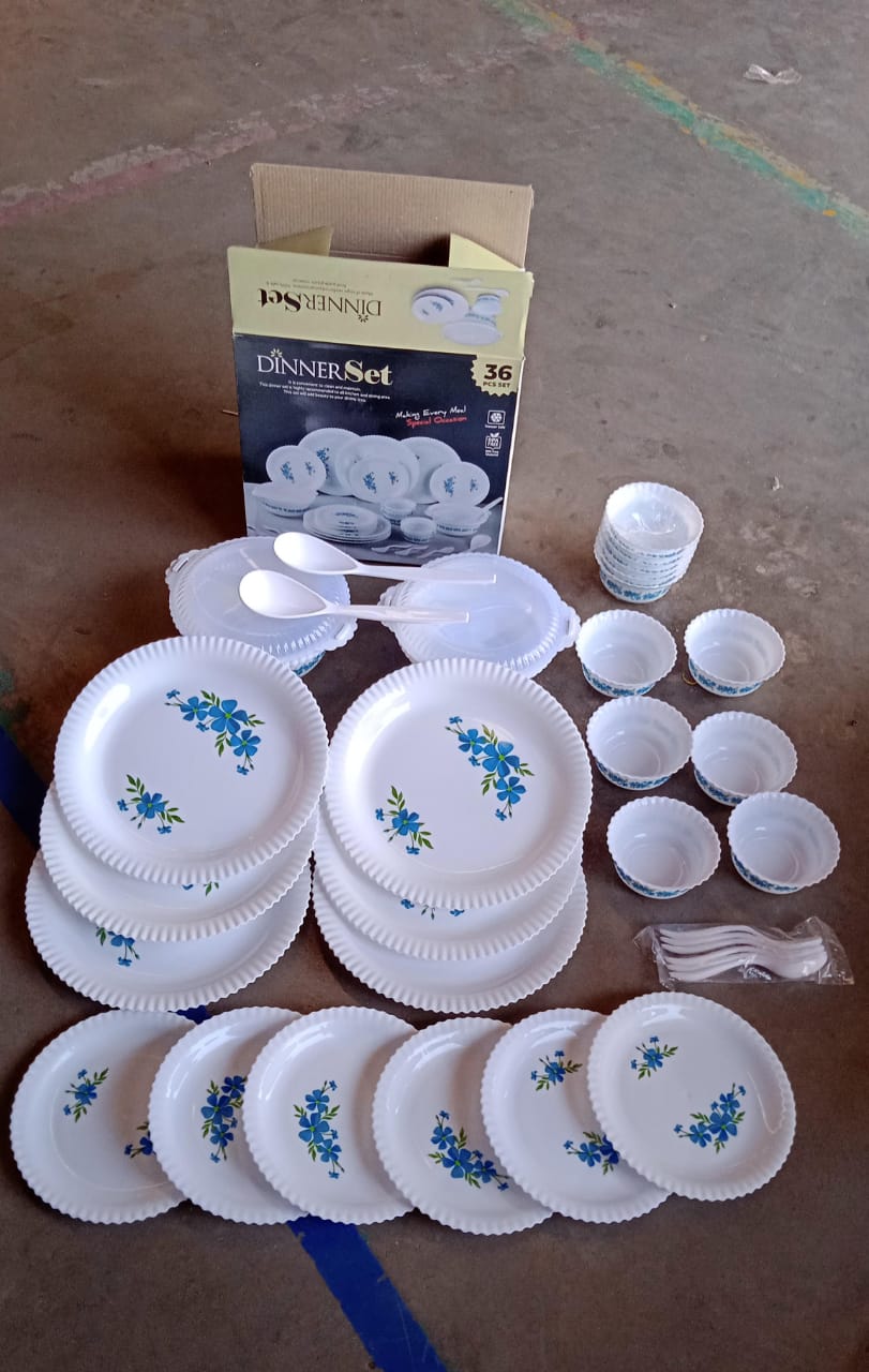 Stacked plastic dinner plates adorned with blue floral decoration