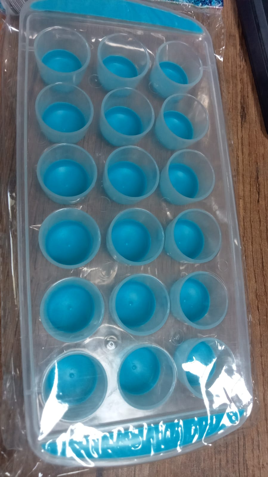 Smart push out round silicone mold for creating ice cubes or mini chocolates.