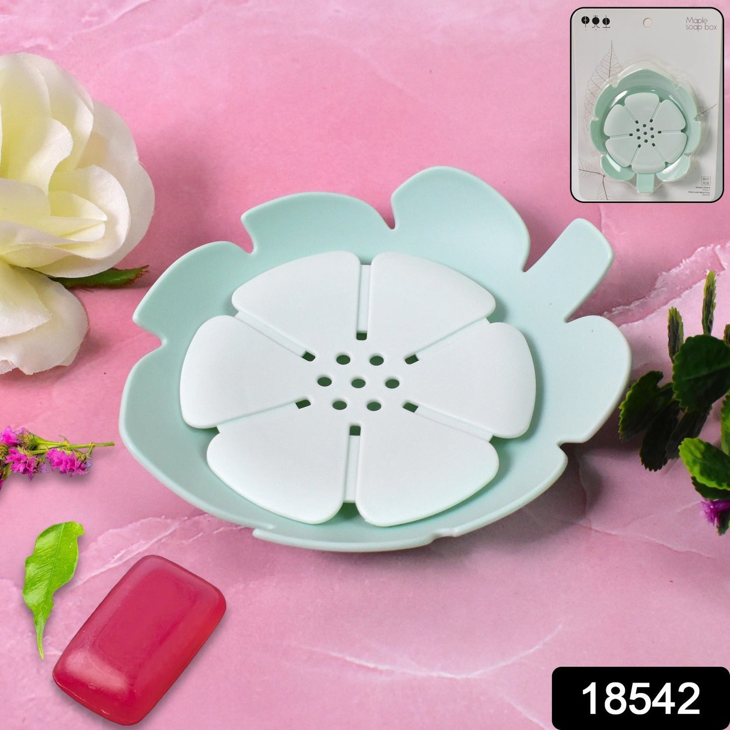 Top-down view of the self-draining plastic soap holder, showcasing its petal-like structure.