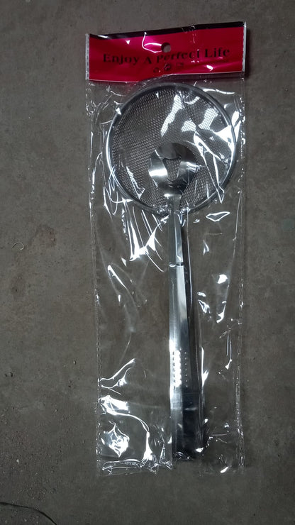 Frying filter spoon with clip used in a modern kitchen setting.