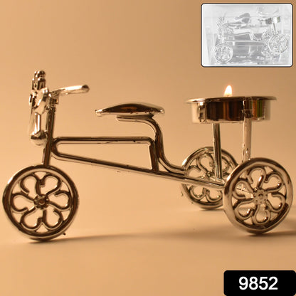 Decorative cycle candle holder with lit tealight for Diwali festival