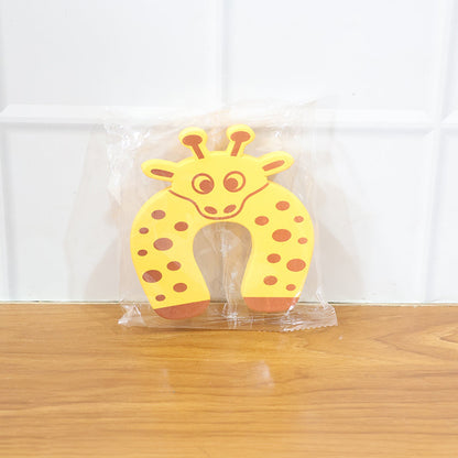 Close-up of the door stopper securely placed under a door on the floor.