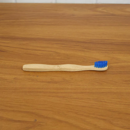 Wooden toothbrush in natural setting, eco-friendly material