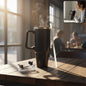 Black insulated travel coffee mug with handle and lid