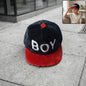 Boys printed fashion cap with letter design showing stylish casual headwear