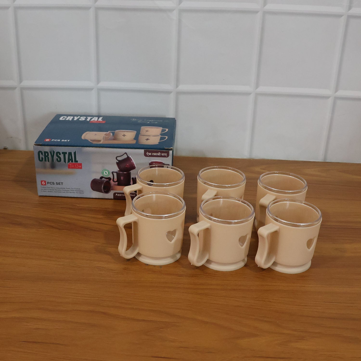 Hand holding a 100ML heart design mini tea coffee mug