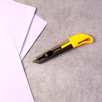 Angled view of heavy-duty utility cutter knife