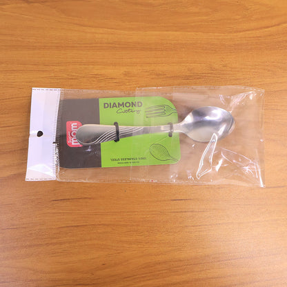 Shiny stainless steel dessert spoon displayed on a white surface