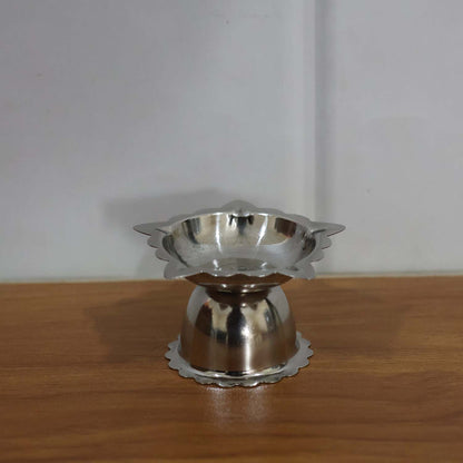 Silver-toned stainless steel sunflower diya for pooja and aarti rituals