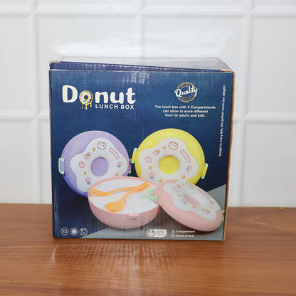 Person holding a Donut Lunch Box, demonstrating its portable design.