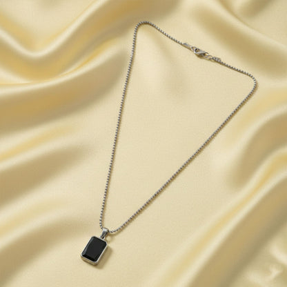 Side view of men's durable stainless-steel pendant chain with black pendant