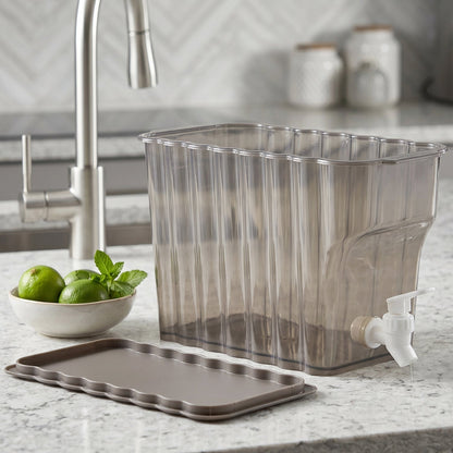 Product display of the clear plastic beverage dispenser on a kitchen counter