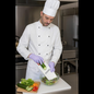 Close-up of the Multipurpose Slicer in action, demonstrating vegetable julienning.