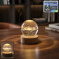 3D Astronomy Crystal Ball Lamp glowing softly on a wooden base.