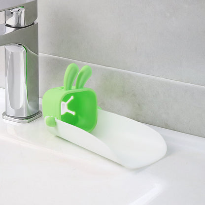 Hand demonstrating the flexible, durable silicone material of the faucet extender.