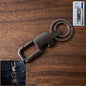 Heavy duty metal key holder featuring a secure carabiner clip and rotating mechanism.