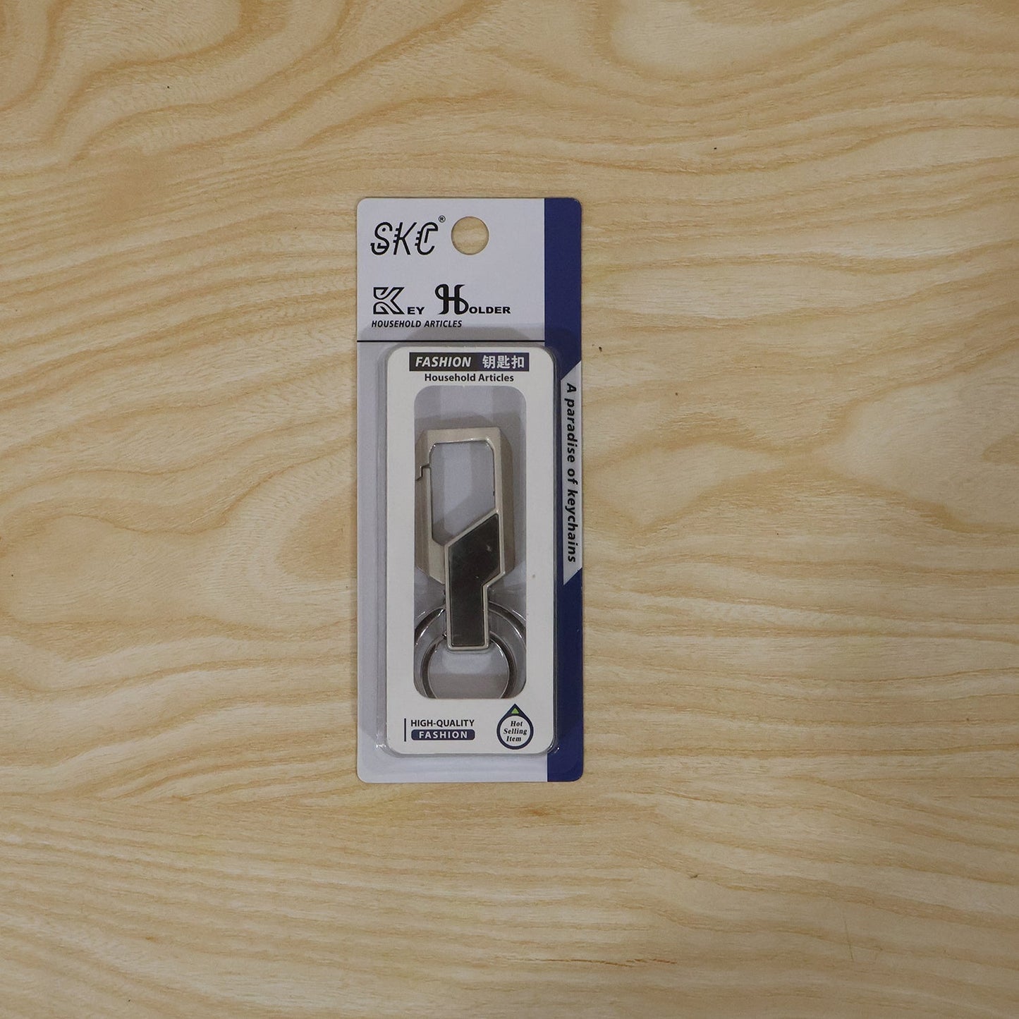 Lifestyle shot of stainless steel key holder attached to bag for travel