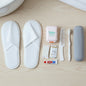 8 in 1 compact travel grooming kit including slippers, toothbrush, and comb